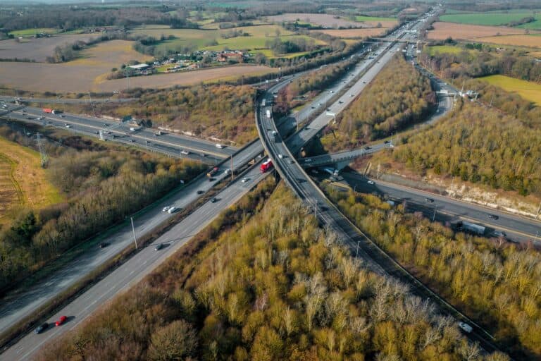 A busy UK motorway one afternoon in the concept of 'Can You Use a Man and Van Service for Long-Distance Moves'.