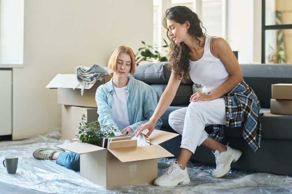 Flatmates unpacking after the move